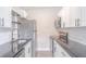 Contemporary kitchen with stainless appliances, subway tile backsplash and stylish cabinets at 673 E Church Ave, Longwood, FL 32750