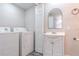Bright laundry room and sink with gray wood flooring at 673 E Church Ave, Longwood, FL 32750