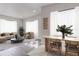 Open living room showcases modern decor, hardwood floors, and lots of natural light at 673 E Church Ave, Longwood, FL 32750