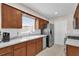 Cozy kitchen with ample cabinet space, modern appliances, and bright countertops at 6824 Chaucer Ln, Orlando, FL 32809