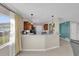Open kitchen featuring a breakfast bar, pendant lighting, and modern finishes at 6824 Chaucer Ln, Orlando, FL 32809