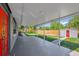 Large covered patio with a backyard view, a shed, and access to the home at 6824 Chaucer Ln, Orlando, FL 32809