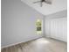 A bright bedroom featuring modern floors and ample closet space at 707 Stonewyk Way, Kissimmee, FL 34744