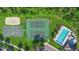 Aerial view of the community amenities including a pool, basketball court, and tennis courts at 707 Stonewyk Way, Kissimmee, FL 34744
