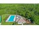 Aerial view of community clubhouse and pool area with playground and sun deck at 707 Stonewyk Way, Kissimmee, FL 34744
