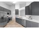 An open kitchen with stainless steel appliances, shaker cabinets and quartz countertops at 707 Stonewyk Way, Kissimmee, FL 34744