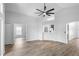 Large open-concept living area with vaulted ceiling and contemporary flooring at 707 Stonewyk Way, Kissimmee, FL 34744