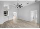 An open living space featuring vaulted ceilings, modern flooring and neutral paint at 707 Stonewyk Way, Kissimmee, FL 34744