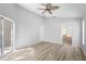 Spacious main bedroom boasts modern flooring and easy bathroom access at 707 Stonewyk Way, Kissimmee, FL 34744