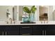 Elegant bathroom showcasing a double vanity with modern fixtures and stylish decor at 729 Lake Dell Ave, Dundee, FL 33838