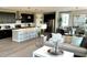 Open-concept living room with modern furnishings, sleek kitchen island, and contemporary decor at 729 Lake Dell Ave, Dundee, FL 33838