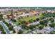 Aerial view of a neighborhood with private pools in a suburban setting with mature trees and manicured lawns at 7745 Comrow St, Kissimmee, FL 34747