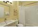 Cozy bathroom featuring a shower tub combo and a sink with vanity at 7745 Comrow St, Kissimmee, FL 34747