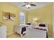 Charming bedroom featuring two twin beds, whimsical décor, and a bright, cheerful ambiance at 7745 Comrow St, Kissimmee, FL 34747