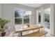 Sunlit dining area with clear view of screened pool and outdoor living space at 7745 Comrow St, Kissimmee, FL 34747