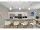 Open kitchen featuring stainless steel appliances, granite counters, and bar stool seating at 7745 Comrow St, Kissimmee, FL 34747