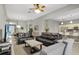 Open living room boasts natural light, modern furnishings, and neutral colors at 7745 Comrow St, Kissimmee, FL 34747