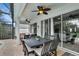 View of patio with dark-stained furniture, a ceiling fan, and access to interior at 7745 Comrow St, Kissimmee, FL 34747
