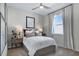 Bright bedroom boasts a ceiling fan, large window, and a cozy, inviting atmosphere at 811 Lake Dell Rd, Dundee, FL 33838