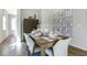 Formal dining area with elegant table setting, creating a perfect space for entertaining guests at 811 Lake Dell Rd, Dundee, FL 33838