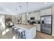 Spacious kitchen featuring a center island, stainless steel appliances, and ample cabinet space for modern living at 811 Lake Dell Rd, Dundee, FL 33838