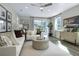 Inviting living room with plush sofas, stylish furnishings, and plenty of natural light for a cozy atmosphere at 811 Lake Dell Rd, Dundee, FL 33838