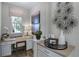 An office space with white cabinets and shelves, a desk, and decor at 811 Lake Dell Rd, Dundee, FL 33838