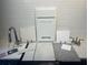 Kitchen tile samples on counter with faucet and cabinet providing options for stylish customization at 811 Lake Dell Rd, Dundee, FL 33838
