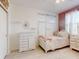 Bedroom with four-poster bed and vintage white dresser at 8635 Tallfield Ave, Orlando, FL 32832