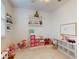 Bright ' bedroom with shelving, storage, and a whiteboard at 8635 Tallfield Ave, Orlando, FL 32832