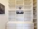 Custom closet shelving and drawers offer ample storage and organization, complete with decorative baskets at 8635 Tallfield Ave, Orlando, FL 32832