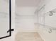 Walk-in closet with metal shelving and light wood floors at 8635 Tallfield Ave, Orlando, FL 32832