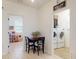 Charming eating nook adjacent to the laundry room and play area, perfect for Gathering meals at 8635 Tallfield Ave, Orlando, FL 32832