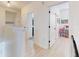 Upstairs hallway featuring pristine white walls and doorways leading to various rooms in the house at 8635 Tallfield Ave, Orlando, FL 32832