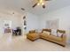 Inviting living room with a comfortable sofa, dining set, and convenient access to the laundry area at 8635 Tallfield Ave, Orlando, FL 32832