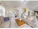 Inviting living room with tile floors, stairs to the second floor, and comfortable seating at 8635 Tallfield Ave, Orlando, FL 32832