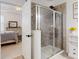 Elegant bathroom featuring a glass-enclosed shower with stylish tile work and modern fixtures at 8635 Tallfield Ave, Orlando, FL 32832