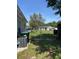 Fenced backyard with grassy lawn and a chain-link fence offering a secure outdoor space at 921 Alecon Dr, Orlando, FL 32808