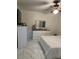 Comfortable bedroom featuring sleek marble floors, a ceiling fan, and modern white dresser at 921 Alecon Dr, Orlando, FL 32808