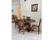 Inviting dining area showcasing a polished wooden table and comfortable upholstered chairs at 921 Alecon Dr, Orlando, FL 32808