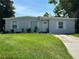 Charming single-story home featuring a well-maintained lawn and a classic concrete driveway at 921 Alecon Dr, Orlando, FL 32808