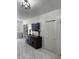 Spacious living room with modern lighting, sleek tiled floors, and elegant dark wood shelving at 921 Alecon Dr, Orlando, FL 32808