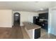 Bright kitchen with modern appliances, a convenient breakfast bar, and open access to the adjacent room at 1895 Hickory Bluff Rd, Kissimmee, FL 34744