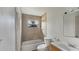 Bathroom features tub and shower combination with tile walls and a window at 1013 Carefree Cove Dr, Winter Haven, FL 33881
