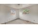 Empty bedroom with two windows and blank walls, ready for personalization and decor at 1013 Carefree Cove Dr, Winter Haven, FL 33881