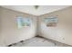 Empty bedroom with two windows providing natural light and potential for customization at 1013 Carefree Cove Dr, Winter Haven, FL 33881