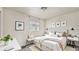 Staged bedroom featuring a comfortable bed, modern decor, and a window for natural light at 1013 Carefree Cove Dr, Winter Haven, FL 33881