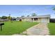 Charming single-story home with a well-maintained front lawn and convenient driveway at 1013 Carefree Cove Dr, Winter Haven, FL 33881