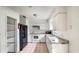 Spacious kitchen with ample counter space, white cabinets, and modern appliances for cooking convenience at 1013 Carefree Cove Dr, Winter Haven, FL 33881