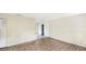 Empty living room with damaged floors and blank walls, ready for renovation at 1013 Carefree Cove Dr, Winter Haven, FL 33881
